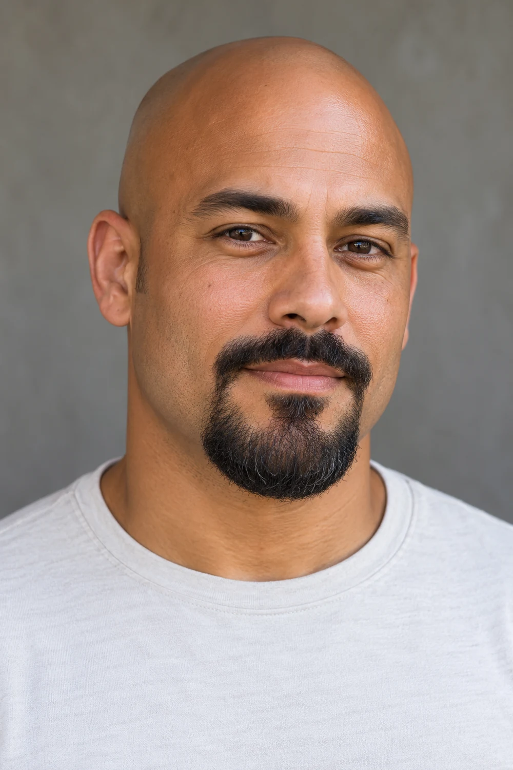 Fictional bald adult man in a light crew-neck shirt wearing a connected circle beard with a curved mustache, clean cheeks, and a rounded chin.