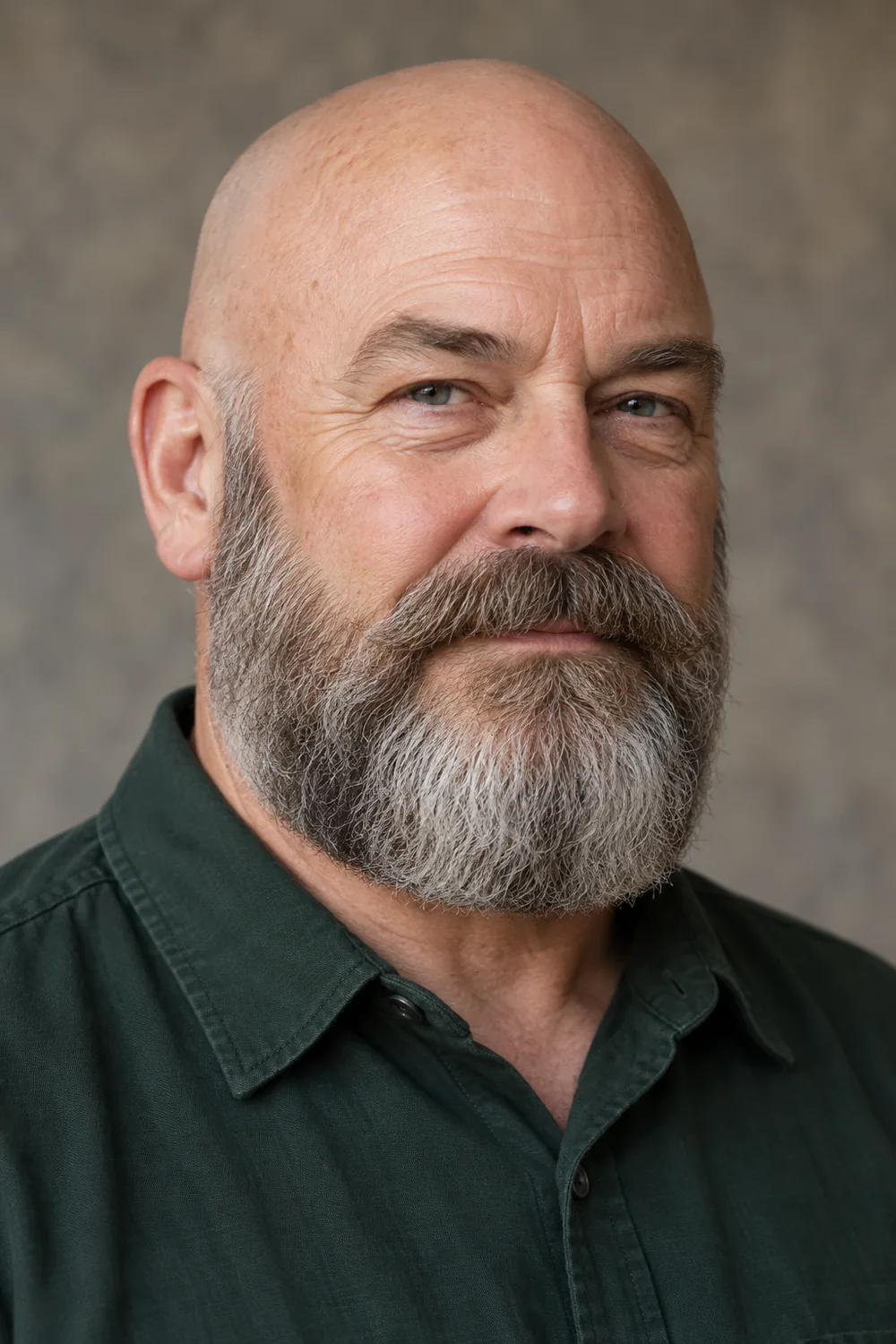 Fictional bald adult man in a dark green shirt, wearing a full salt-and-pepper beard with broad sides and a connected mustache.