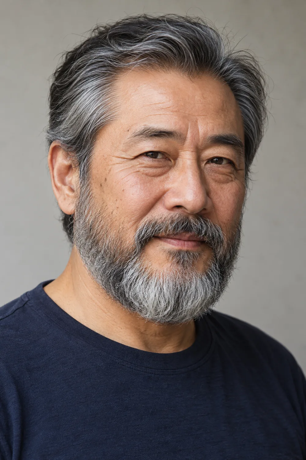 Fictional older East Asian man in a three-quarter portrait, wearing a medium salt-and-pepper beard with full sides, a softly squared chin, and a connected mustache.