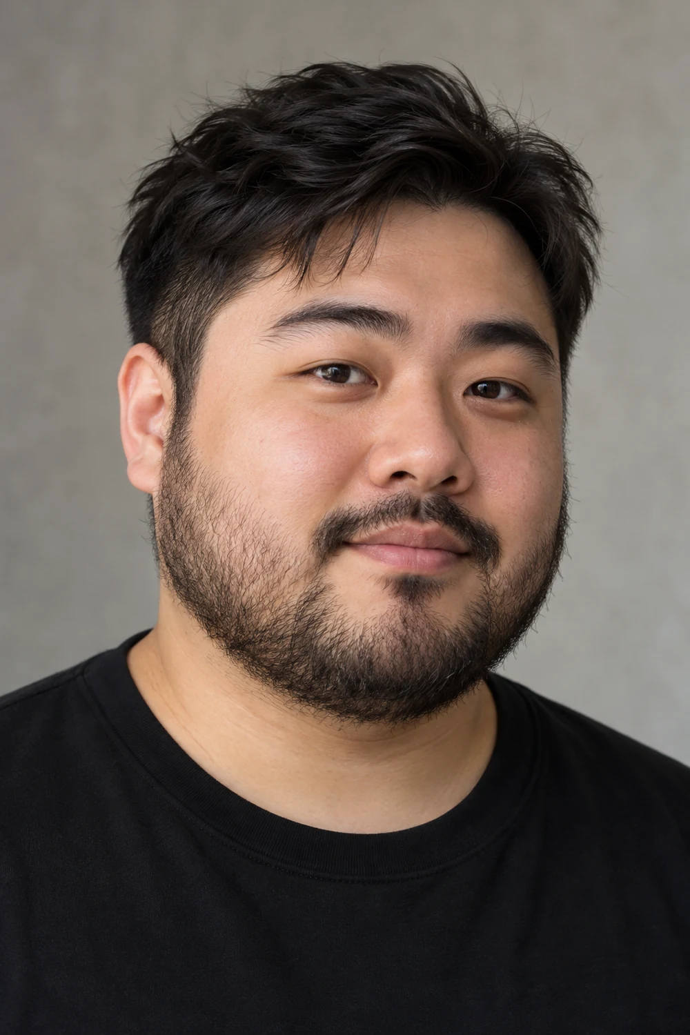 Fictional adult East Asian man with a round face, dense heavy stubble across his cheeks and jaw, and a closely trimmed mustache, wearing a black crew-neck shirt.