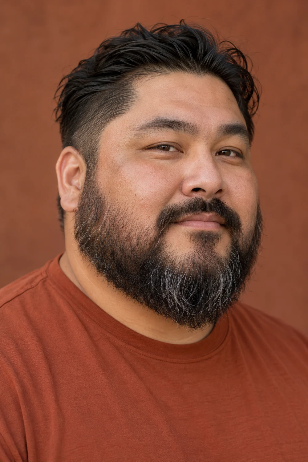 Fictional adult man with a round face, wearing a coarse medium-length beard with natural cheek edges, a connected mustache, and a softly rounded chin.