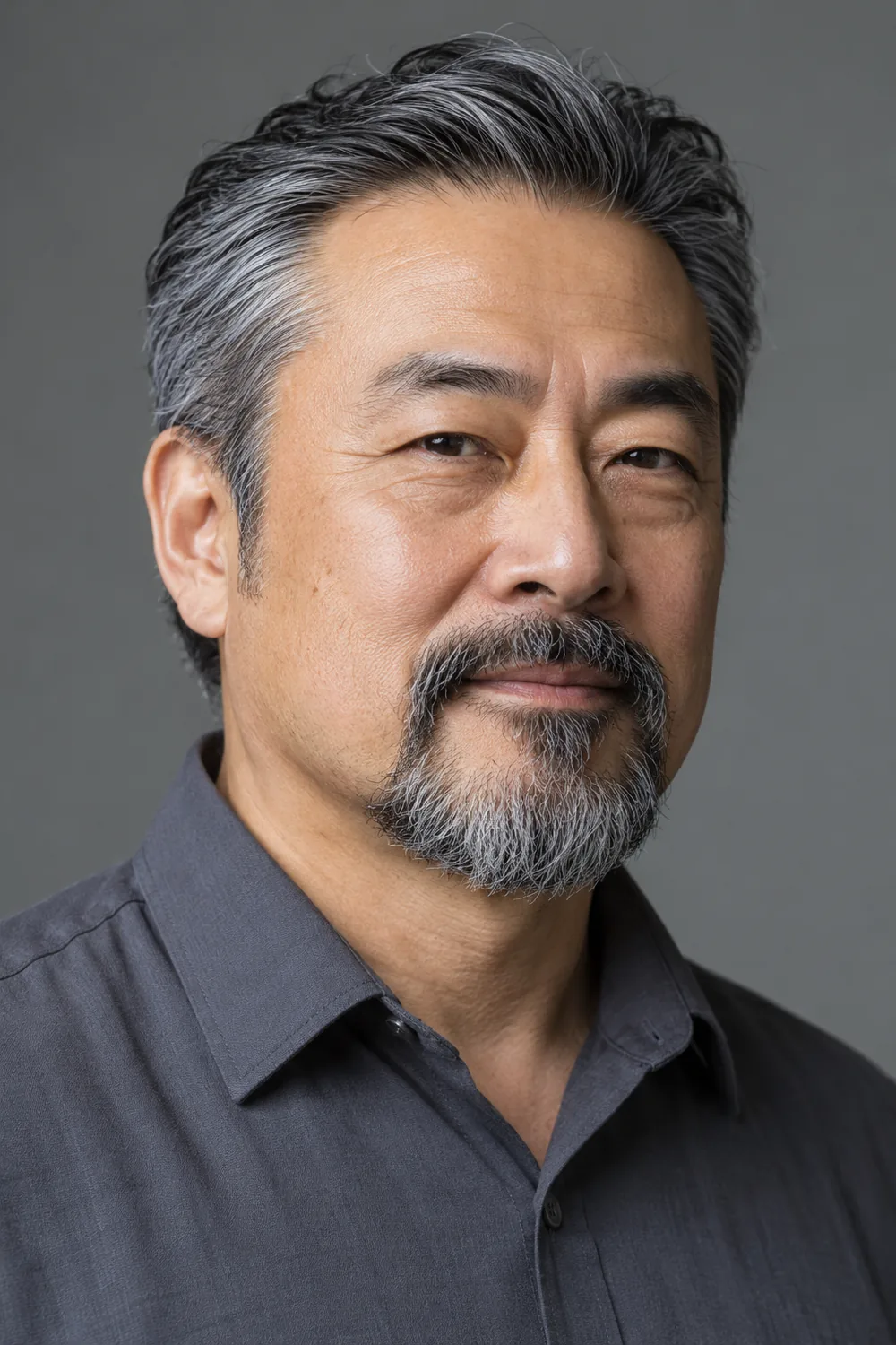 Fictional adult East Asian man with a square face and compact salt-and-pepper circle beard; his mustache joins the rounded chin beard while his cheeks remain clean-shaven.