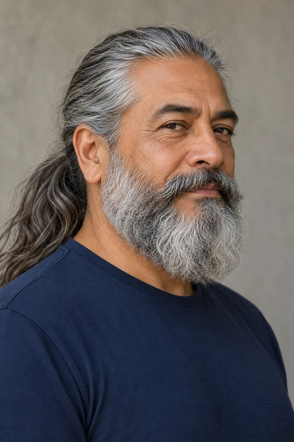 Fictional adult man with long tied-back salt-and-pepper hair and a full rounded gray beard with a connected mustache.