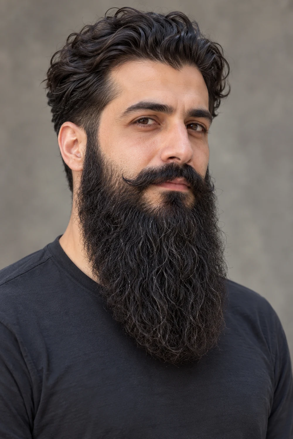 Three-quarter portrait of an adult man with dense wavy black hair, a long full beard ending in a broad rounded tip, and a connected mustache with swept ends.