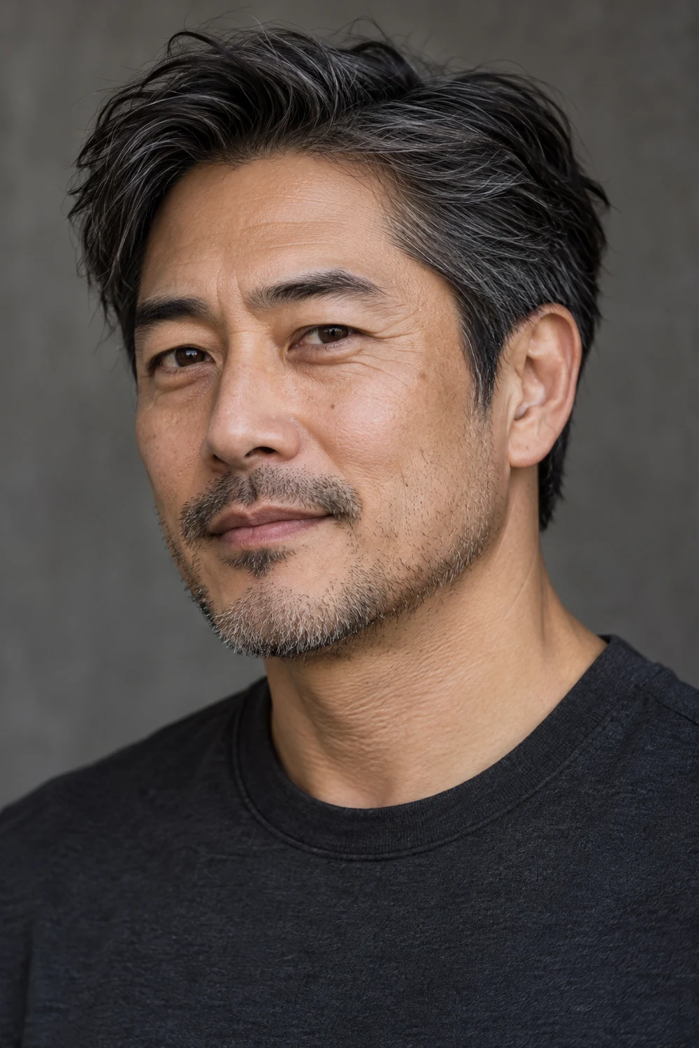 Three-quarter portrait of a fictional adult East Asian man with a narrow band of dark and gray heavy jaw stubble, lighter cheek bristles, and a small connected mustache.